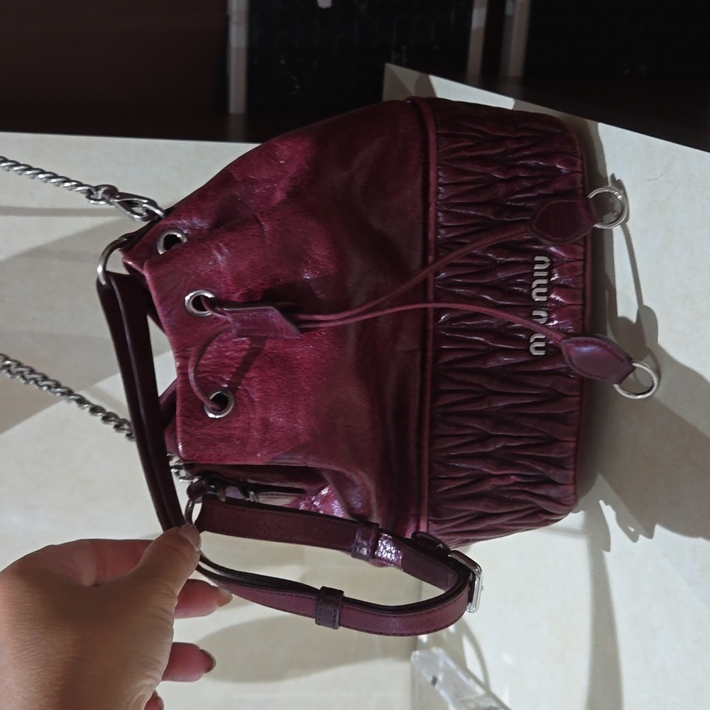 Miu miu bucket hand bag with a long chain and a short handle